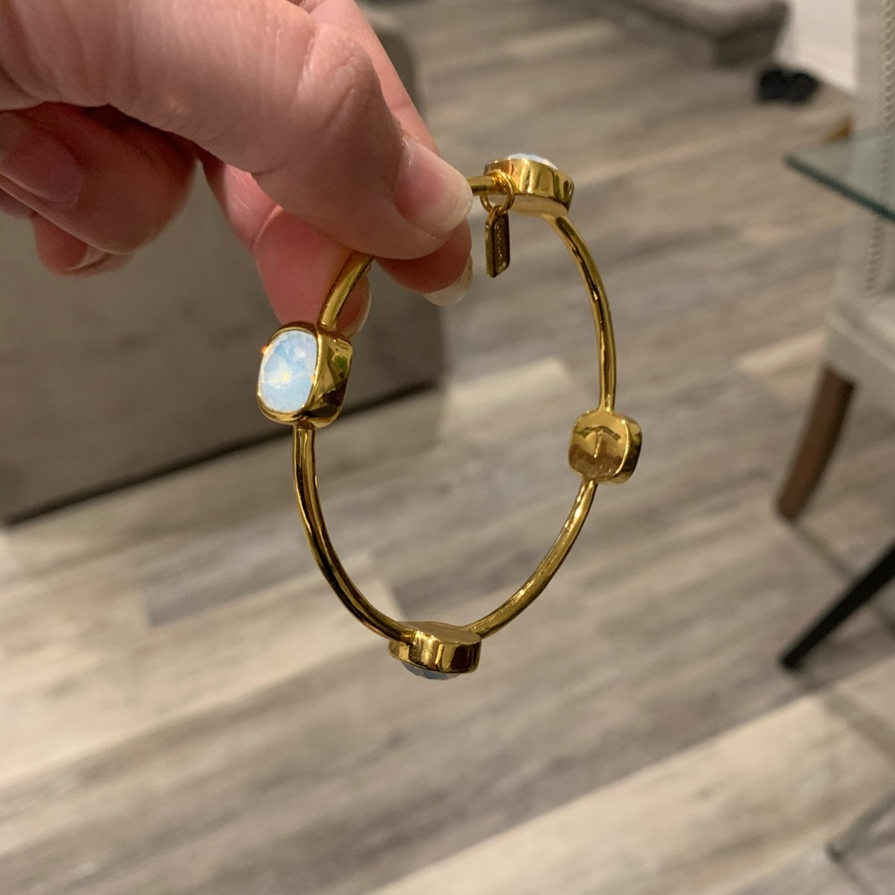 COACH Gold bracelet with light blue gemstones